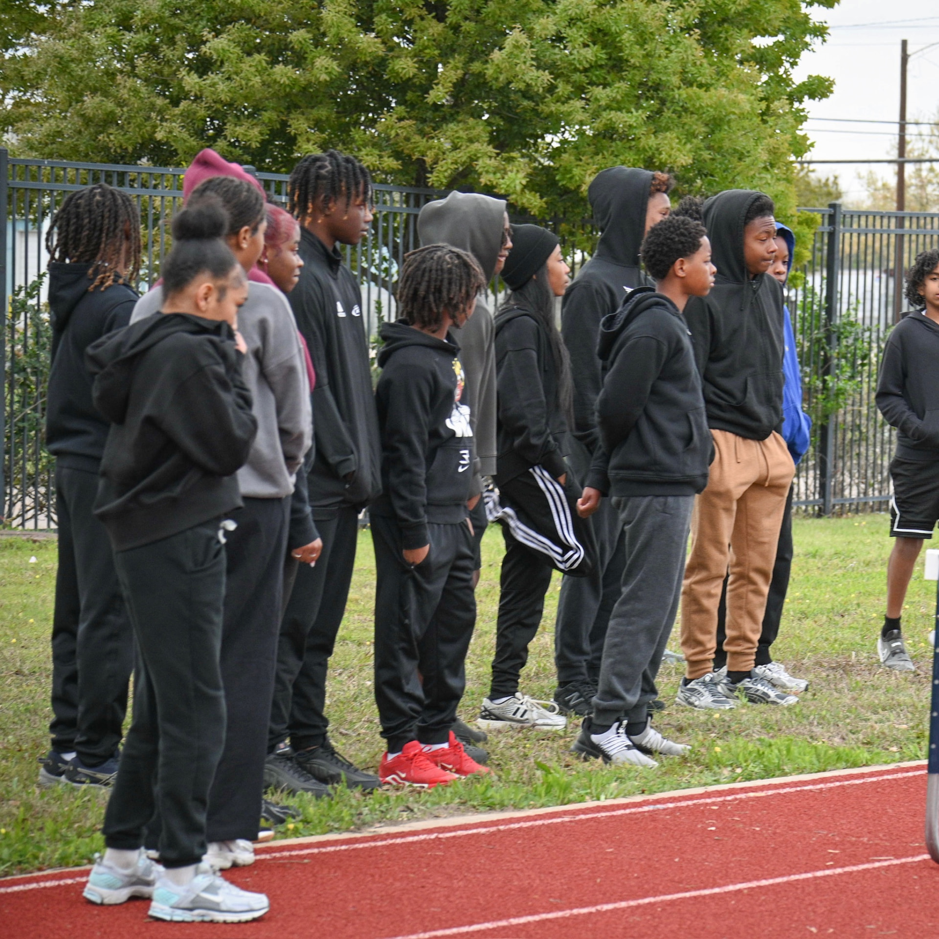 TSE athletes lined up on the grass at practice