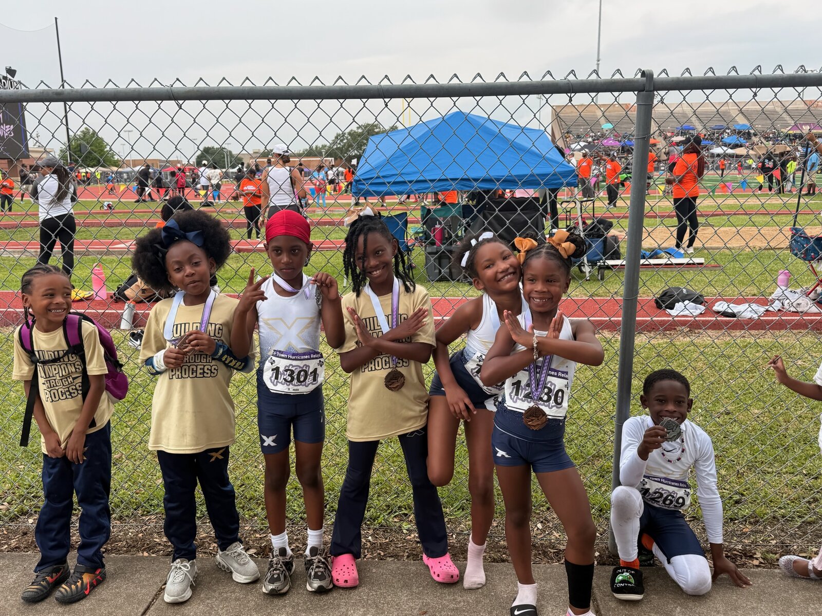 Athletes posing in front of the track after races